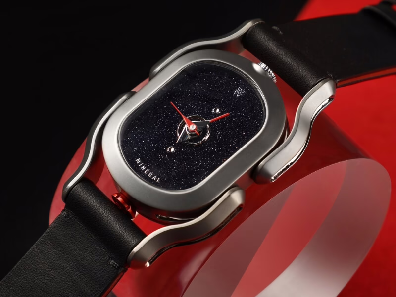 Black W24 with red accents on black-red backdrop